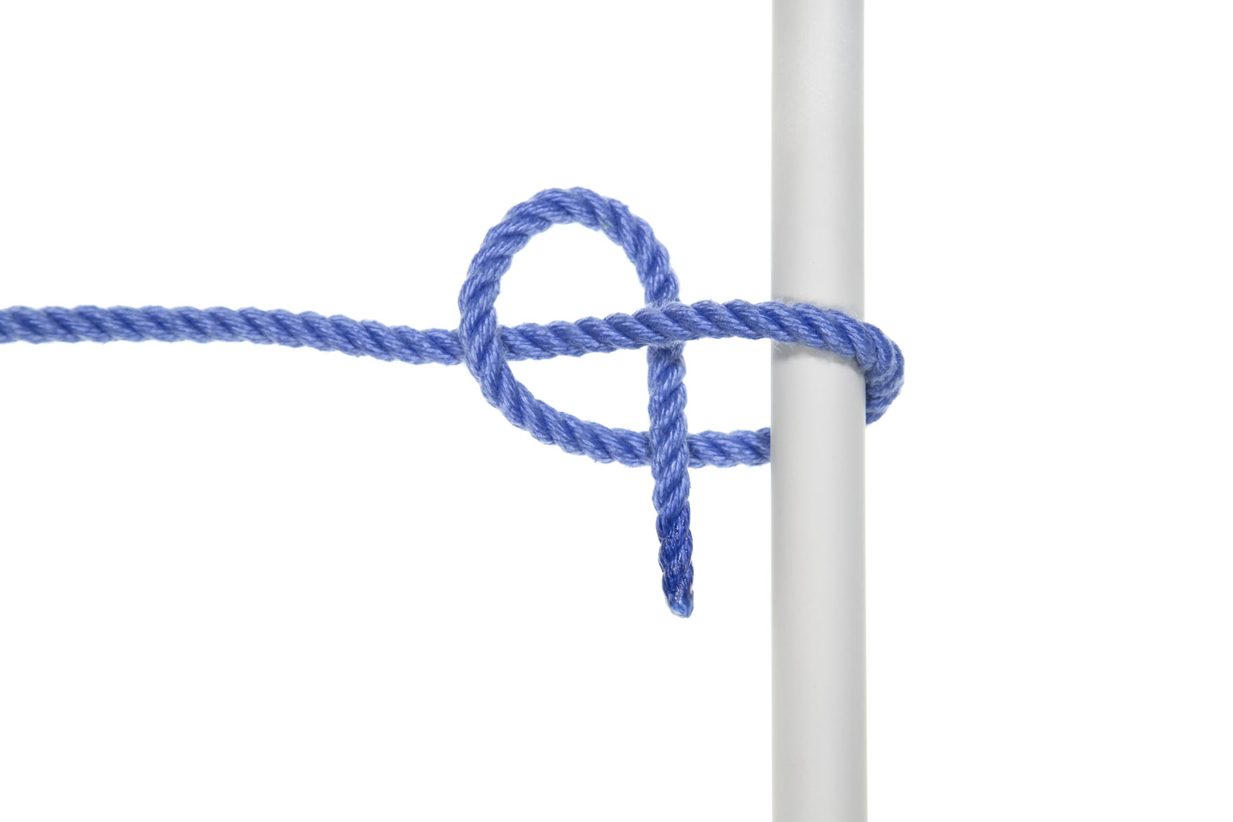 A one inch gray pole crosses the frame vertically. A blue rope enters from the left and goes over the pole, doubles back under it, crosses over the standing part, under the standing part, and over itself, making a half hitch around the pole.