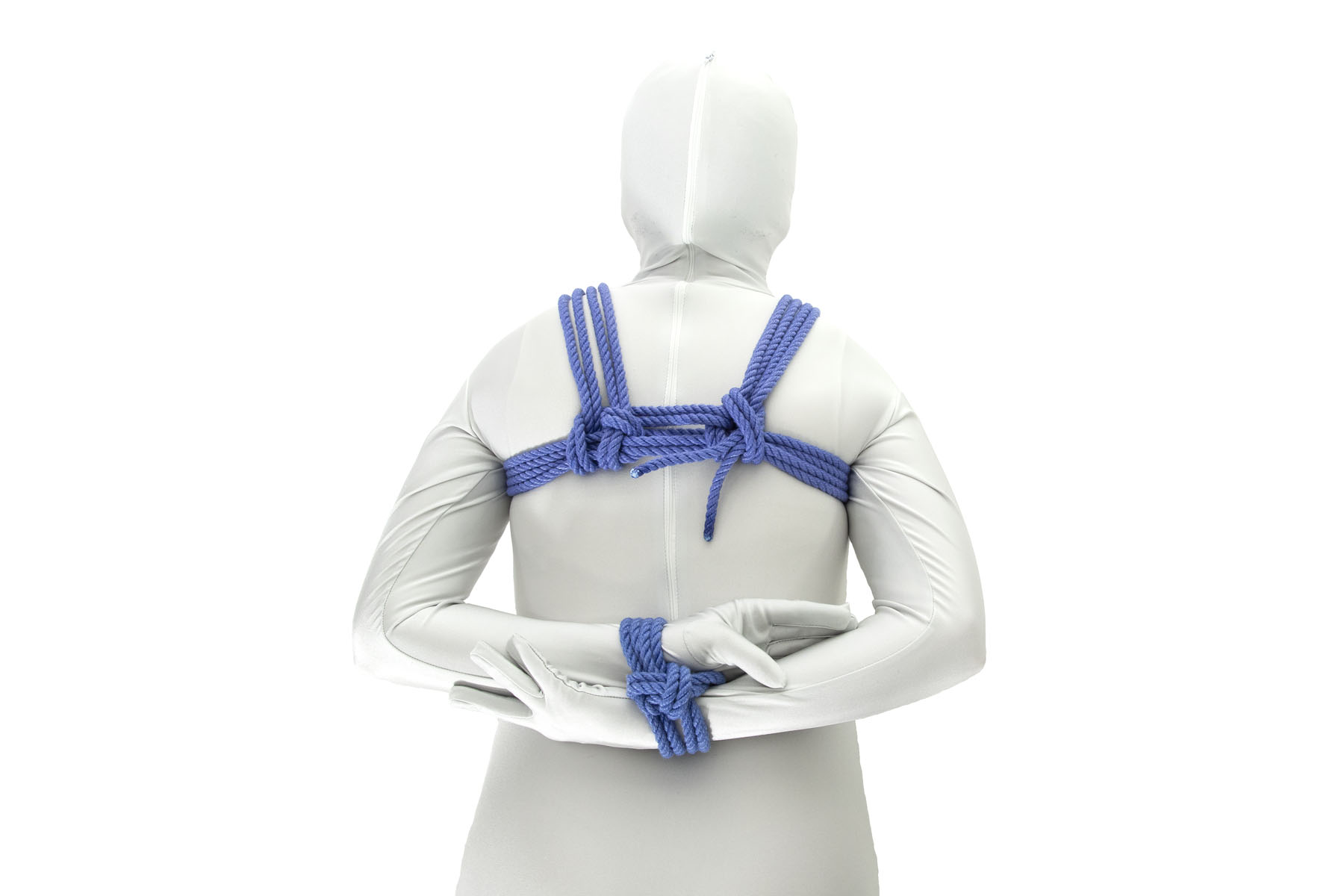 We now see the person from the rear, with a blue wrap going horizontally across their upper back and shoulder lines going from the chest wrap over the shoulders. Their forearms are antiparallel behind their back and their wrists are tied together with a two column tie.
