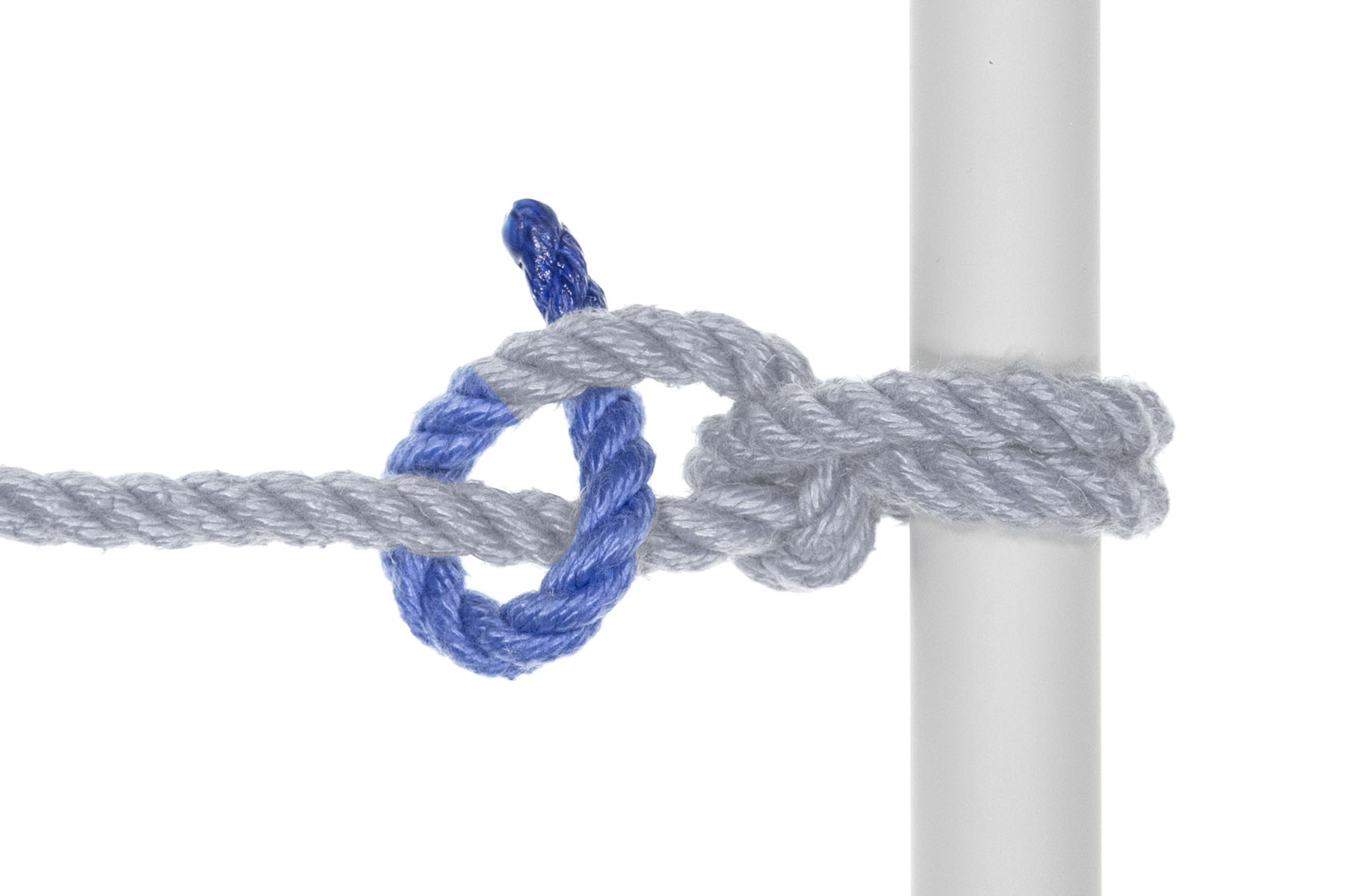 The rope makes a second half hitch by crossing under the standing end, moving back toward the pole, crossing over the standing end, and going under itself.
