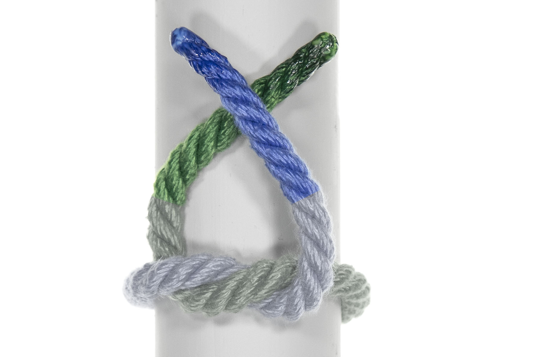 The end of the green rope has been pulled back to the right, almost reaching the right edge of the pole. The blue rope has been similarly bent, and crosses over the green rope about an inch from the ends of both ropes.