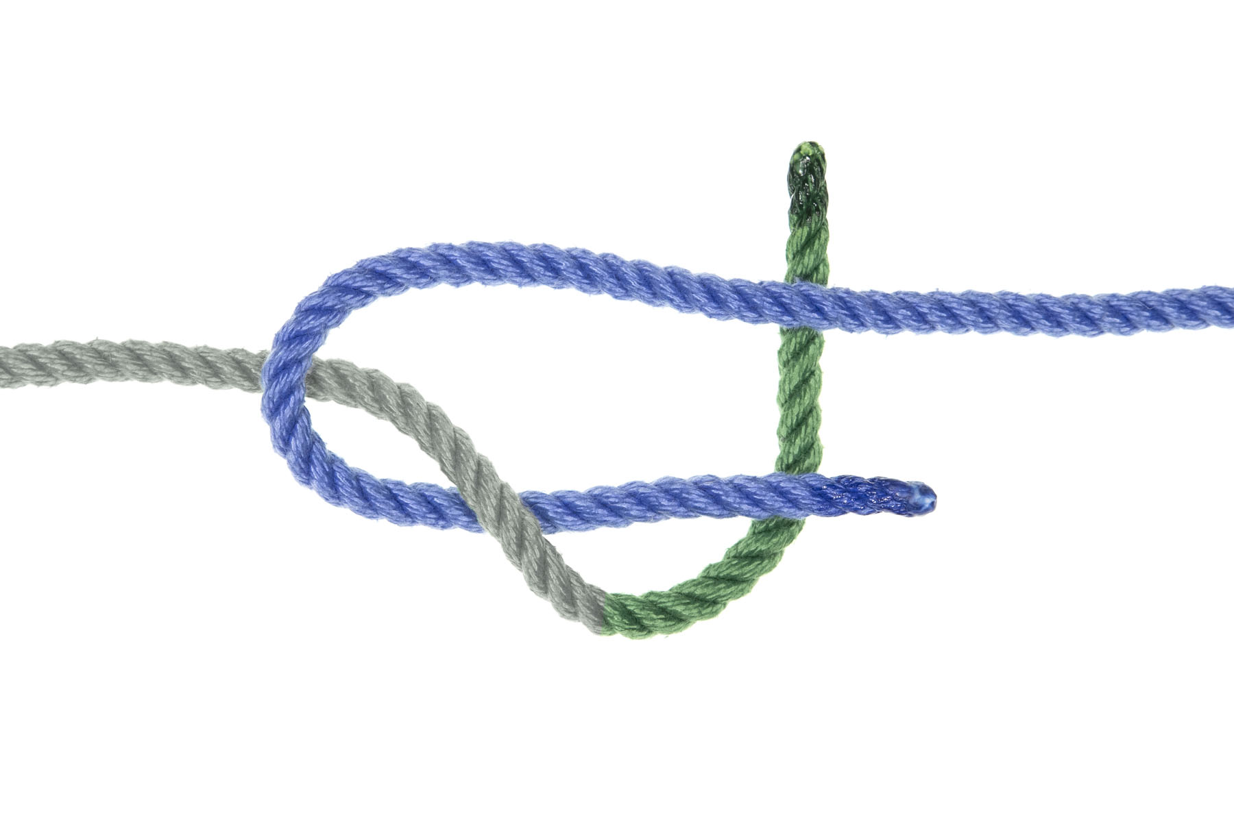 The green rope now turns up, passing under both parts of the blue rope.