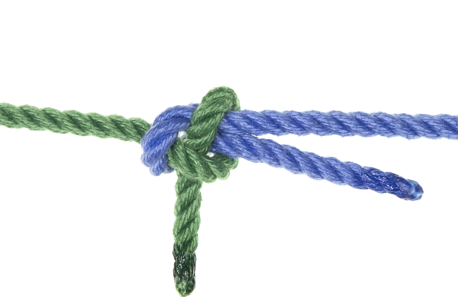 A completed sheet bend knot. A single blue rope enters from the left, connects to a single green rope that enters from the right, and then doubles back, lying next to and just below itself. The green rope goes under the bight of the blue rope, under both parts of the blue rope, the over both parts of the blue rope and under itself, with the end of the rope pointing straight down. The ends of the blue and green ropes are both below their corresponding standing parts.