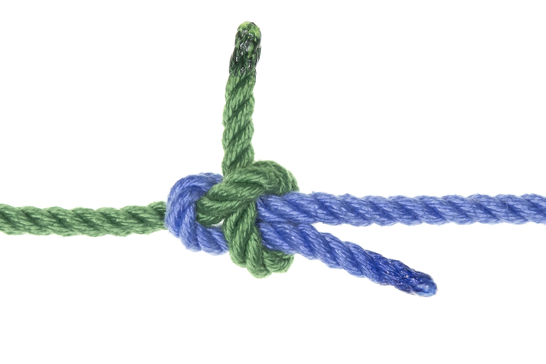 A completed left-hand sheet bend. A single blue rope enters from the left, connects to a single green rope that enters from the right, and then doubles back, lying next to and just below itself. The green rope goes under the bight of the blue rope, under both parts of the blue rope, the over both parts of the blue rope and under itself, with the end of the rope pointing straight up. The critical point here is that the working end of the blue rope lies below its standing part, but the working end of the green rope is above its standing part.