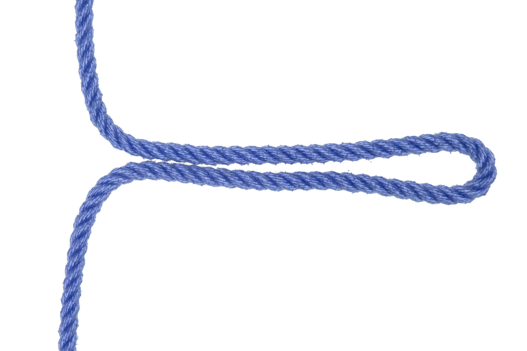 A single blue rope enters from the top. In the center of the frame, an eight inch long bight has been pulled out to the right. The remainder of the rope exits at the bottom.