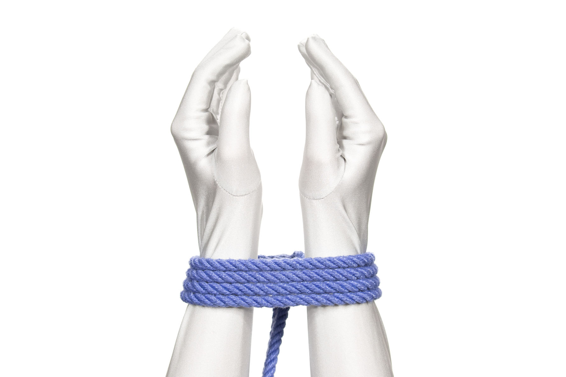 Two hands are tied together by a single column tie at the wrists. Two double wraps go around the wrists and the knot is barely visible on the far side. The wrists have a three inch gap between them.
