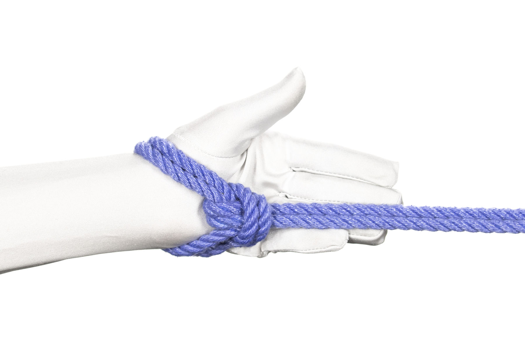 A hand is tied by a single column tie with only one double wrap around the wrist. The single column has been tied loosely, so that the knot lies in the palm of the hand.