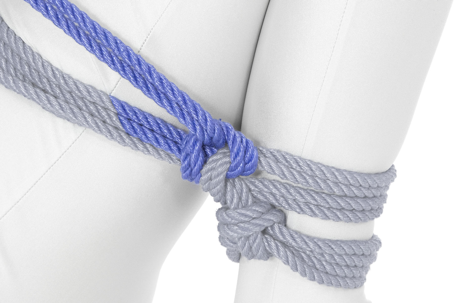 The rope goes around both wraps and through itself, making a half hitch that binds the wraps together.