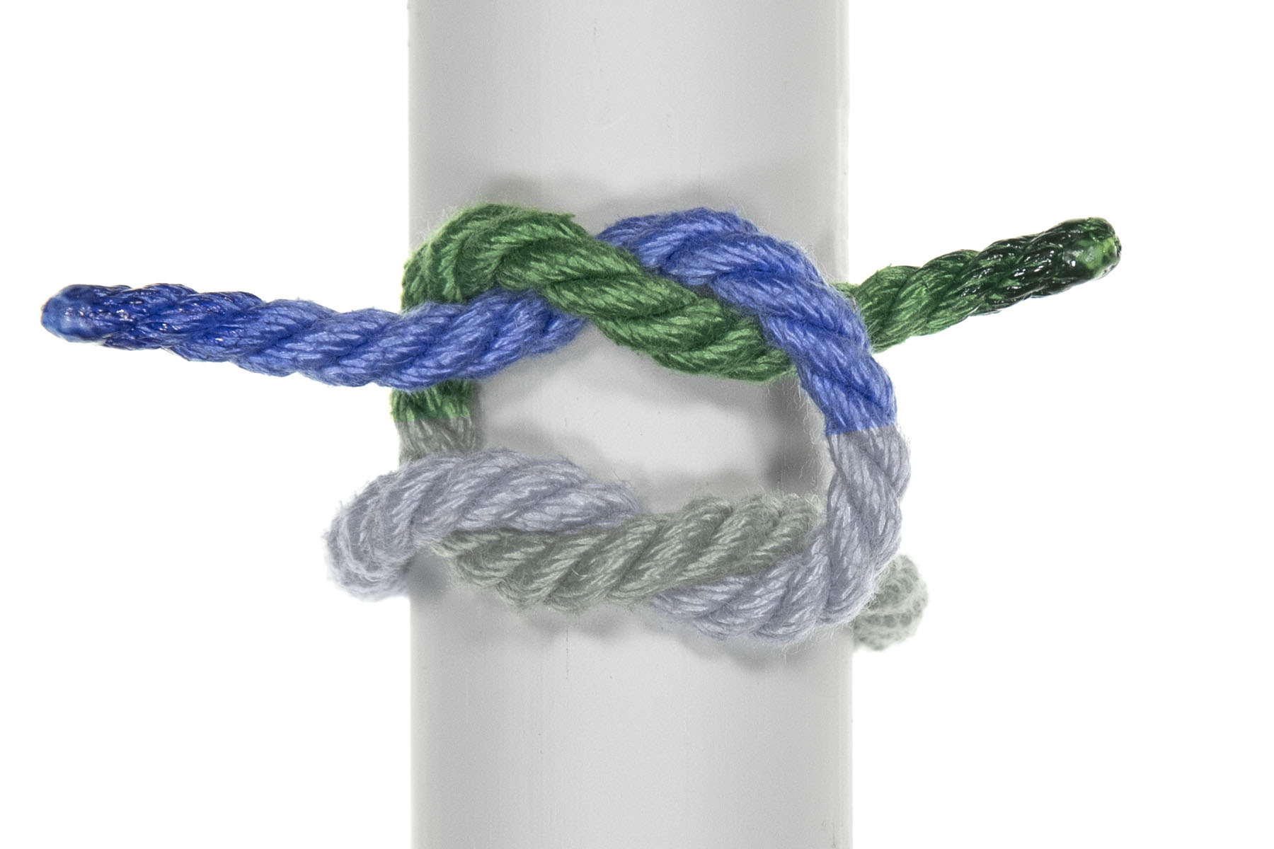 The blue rope has again been twisted around the green rope. The end of the blue rope goes over, under, and over the green rope, and the end of the green rope goes under, over, and under the blue rope.