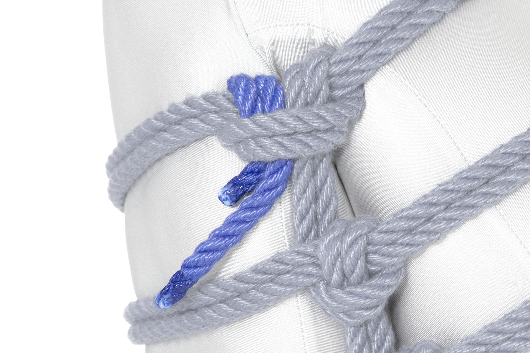 The rope makes a half hitch after the final Munter, securing itself to the upper wrap.