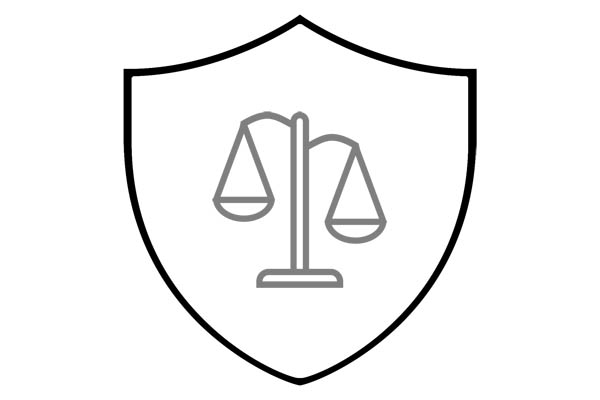 A stylized drawing of a shield with the scales of justice on it.